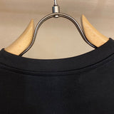 Side profile view of Balmain luxury piece style No.031