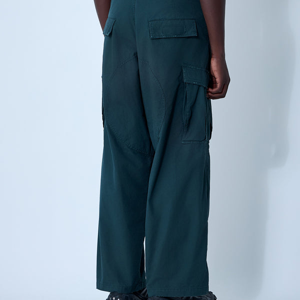 Close-up of Balenciaga pants hardware and fine stitching