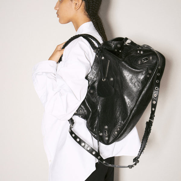 Close-up of Balenciaga totes hardware and fine stitching
