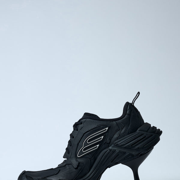 Close-up of Balenciaga pumps hardware and fine stitching