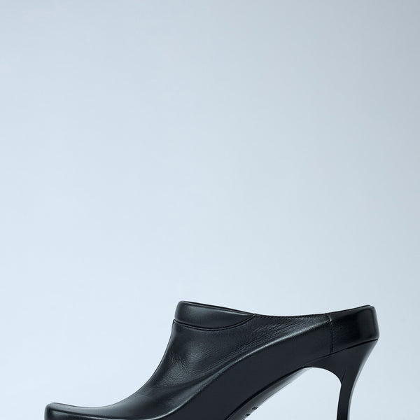Close-up of Balenciaga pumps hardware and fine stitching