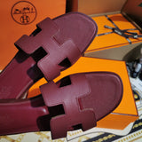 Hermès Grey Slide Sandals - Close-Up Texture View