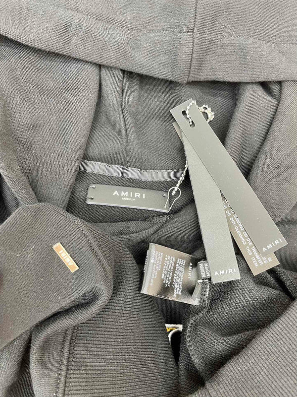 Three-quarter angle view of Amiri luxury piece style No.037