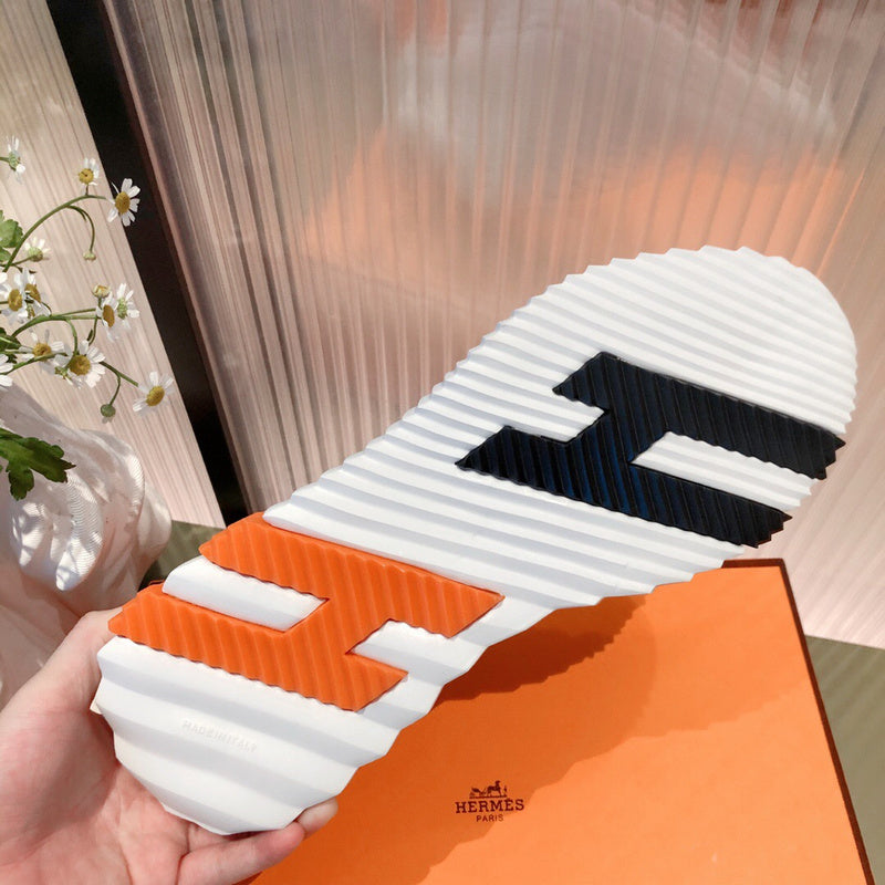 Hermès White High-Top Sneakers - Close-Up Texture View