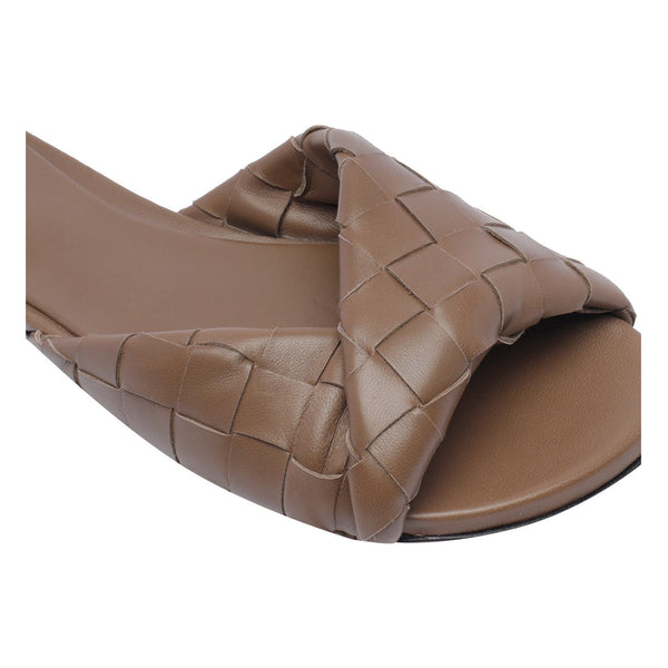 Close-up of Bottega Veneta sandals hardware and fine stitching