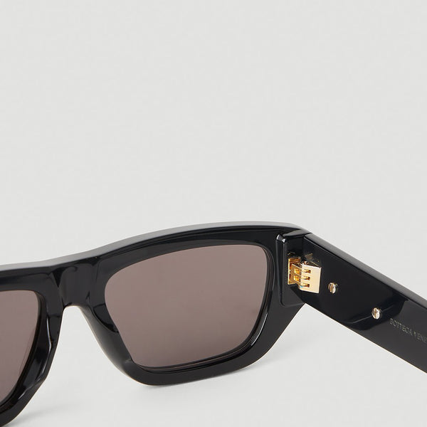 Close-up of Bottega Veneta sunglasses hardware and fine stitching