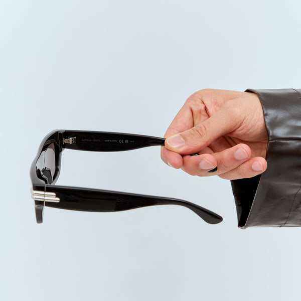Close-up of Bottega Veneta sunglasses hardware and fine stitching