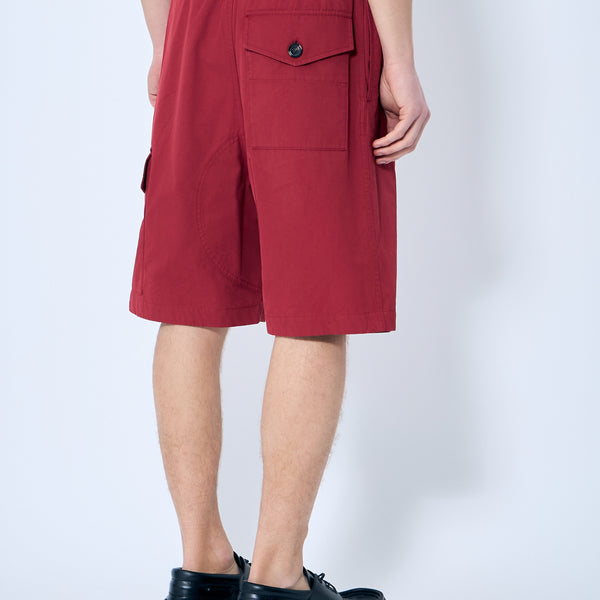 Close-up of Bottega Veneta pants hardware and fine stitching