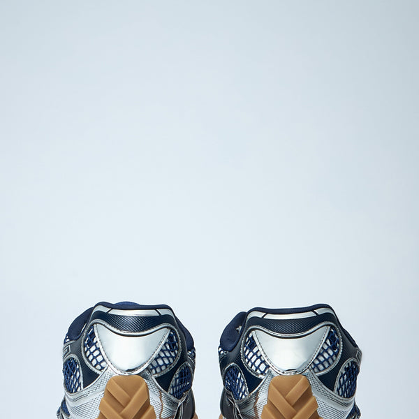 Close-up of Bottega Veneta flats hardware and fine stitching