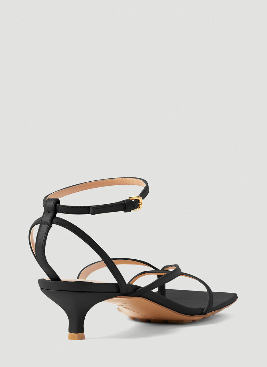 Close-up of Bottega Veneta sandals hardware and fine stitching