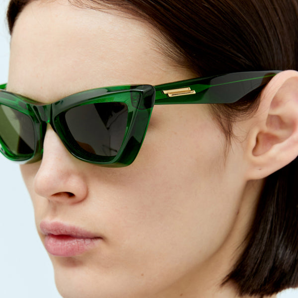 Close-up of Bottega Veneta sunglasses hardware and fine stitching