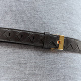 Close-up of Bottega Veneta belts hardware and fine stitching