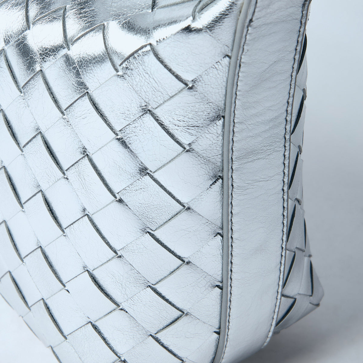 Close-up of Bottega Veneta shoulder bags hardware and fine stitching