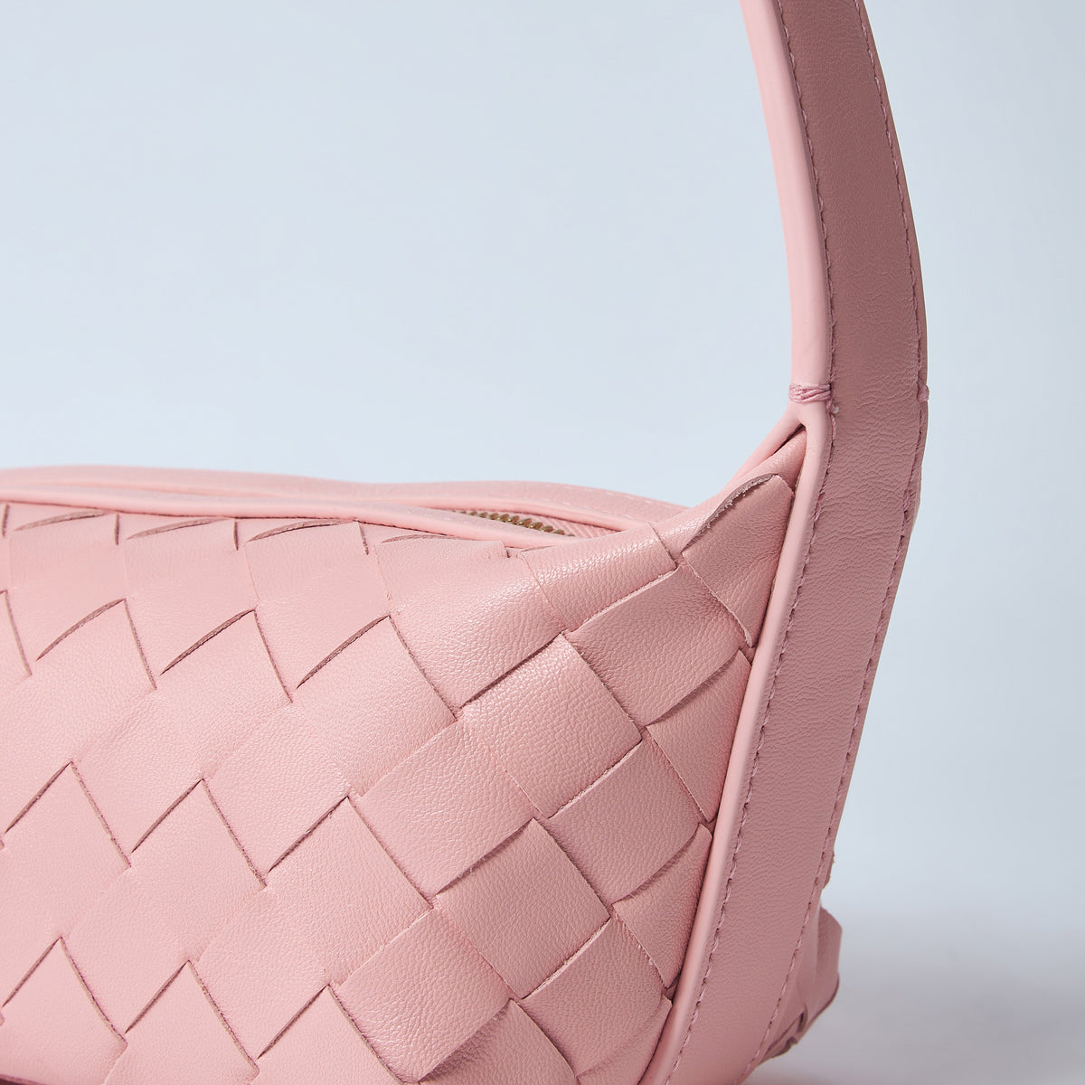 Close-up of Bottega Veneta shoulder bags hardware and fine stitching