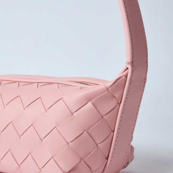 Close-up of Bottega Veneta shoulder bags hardware and fine stitching