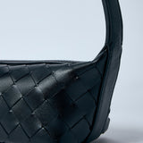 Close-up of Bottega Veneta shoulder bags hardware and fine stitching