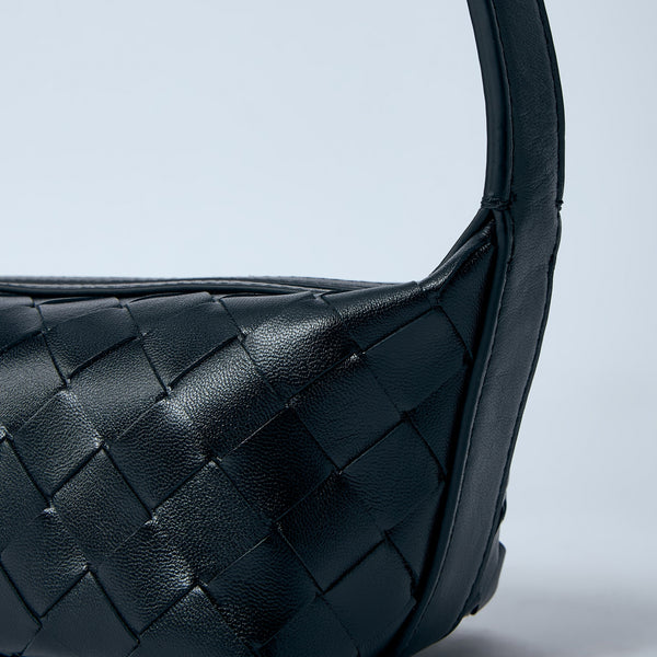 Close-up of Bottega Veneta shoulder bags hardware and fine stitching