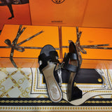 Hermès White Crisscross Strap Sandals - Close-Up Texture View
