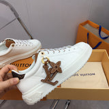 Louis Vuitton White High-Top Sneakers - Angled View