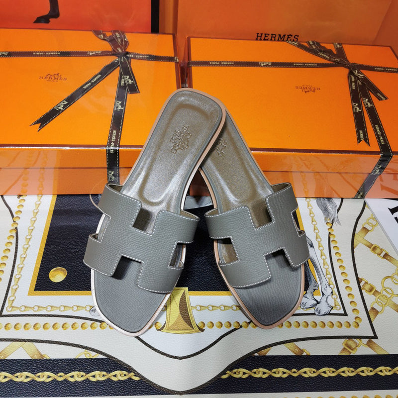 Hermès Camel Flat Thong Sandals - Angled View