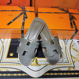 Hermès Camel Flat Thong Sandals - Angled View