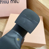 Close-up detail view of Miu Miu luxury piece style No.111