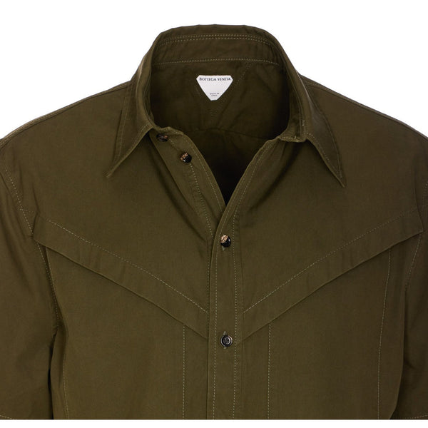 Close-up of Bottega Veneta blouses hardware and fine stitching