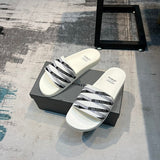 Balenciaga Black Flat Thong Sandals - Close-Up Texture View