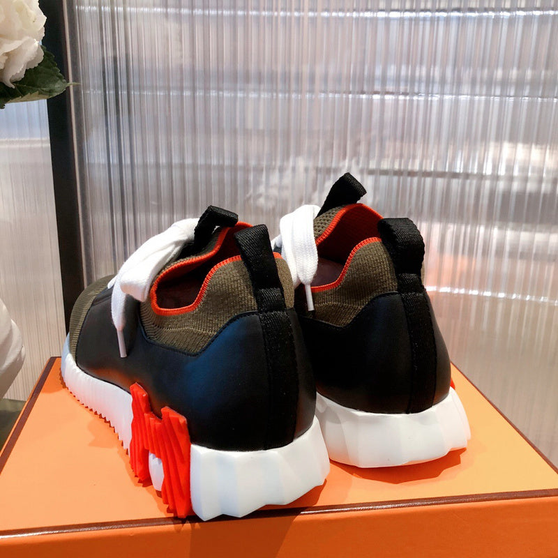 Hermès White High-Top Sneakers - Angled View