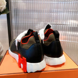 Hermès White High-Top Sneakers - Angled View