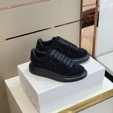 Alexander McQueen Burgundy Slip-On Sneakers - Close-Up Texture View