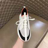 Hermès Red High-Top Sneakers - Angled View