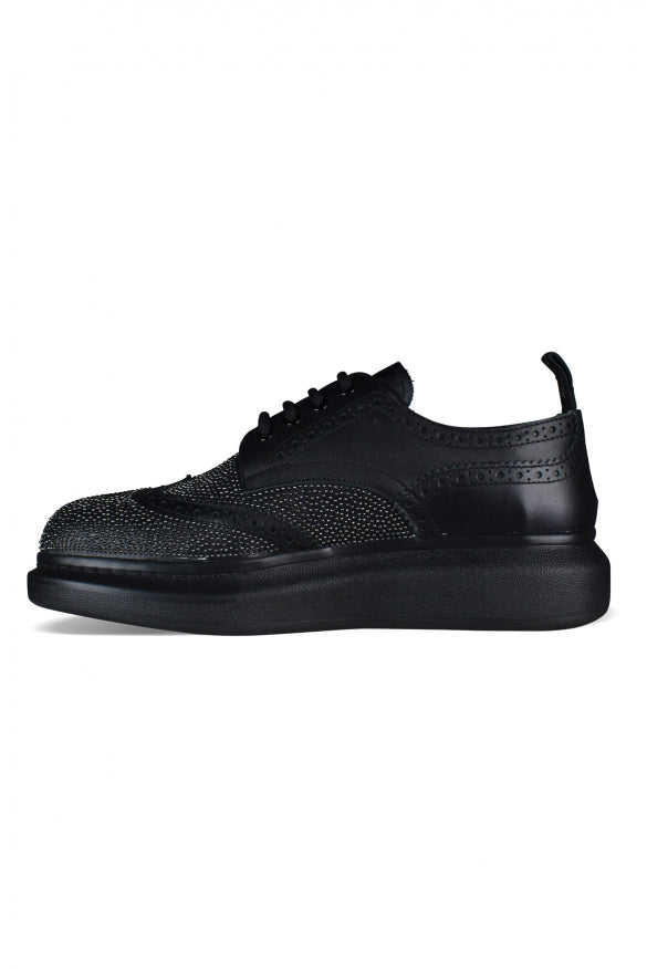 Alexander McQueen athletic side profile designer luxury fashion