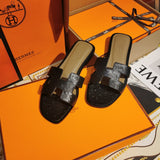 Hermes sandals Style 131 - close-up of classic monogram styling