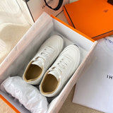 Hermes shoes Style 355 - close-up of statement logo accent (alternate angle)