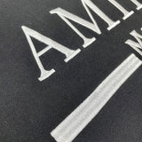 Texture and finish detail of Amiri luxury piece style No.034