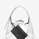 Close-up of Alexander McQueen shoulder bags hardware and fine stitching