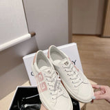 Givenchy Tan Slip-On Sneakers - Close-Up Texture View