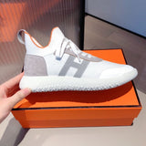 Hermes shoes Style 383 - close-up of iconic logo design (alternate angle)