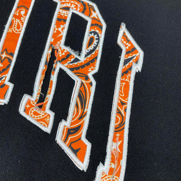Close-up detail view of Amiri luxury piece style No.047