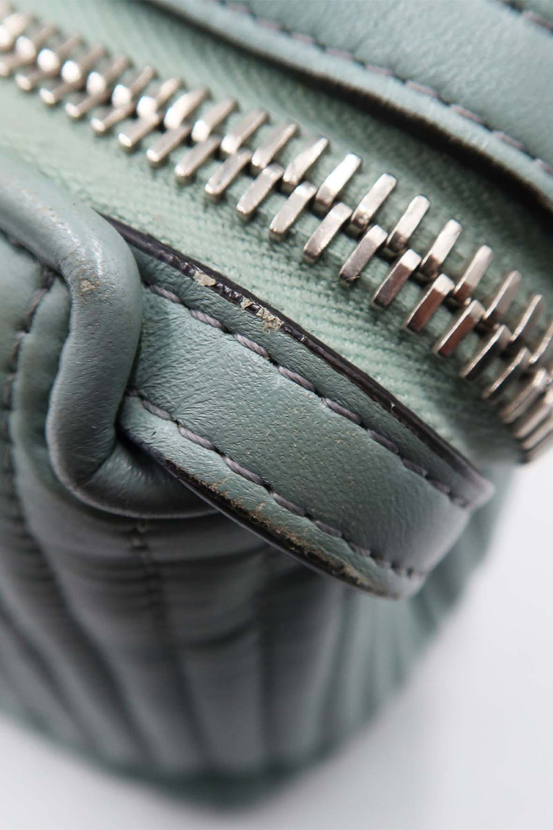 Close-up of DotCom bags hardware and fine stitching
