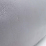 Close-up of DotCom bags hardware and fine stitching
