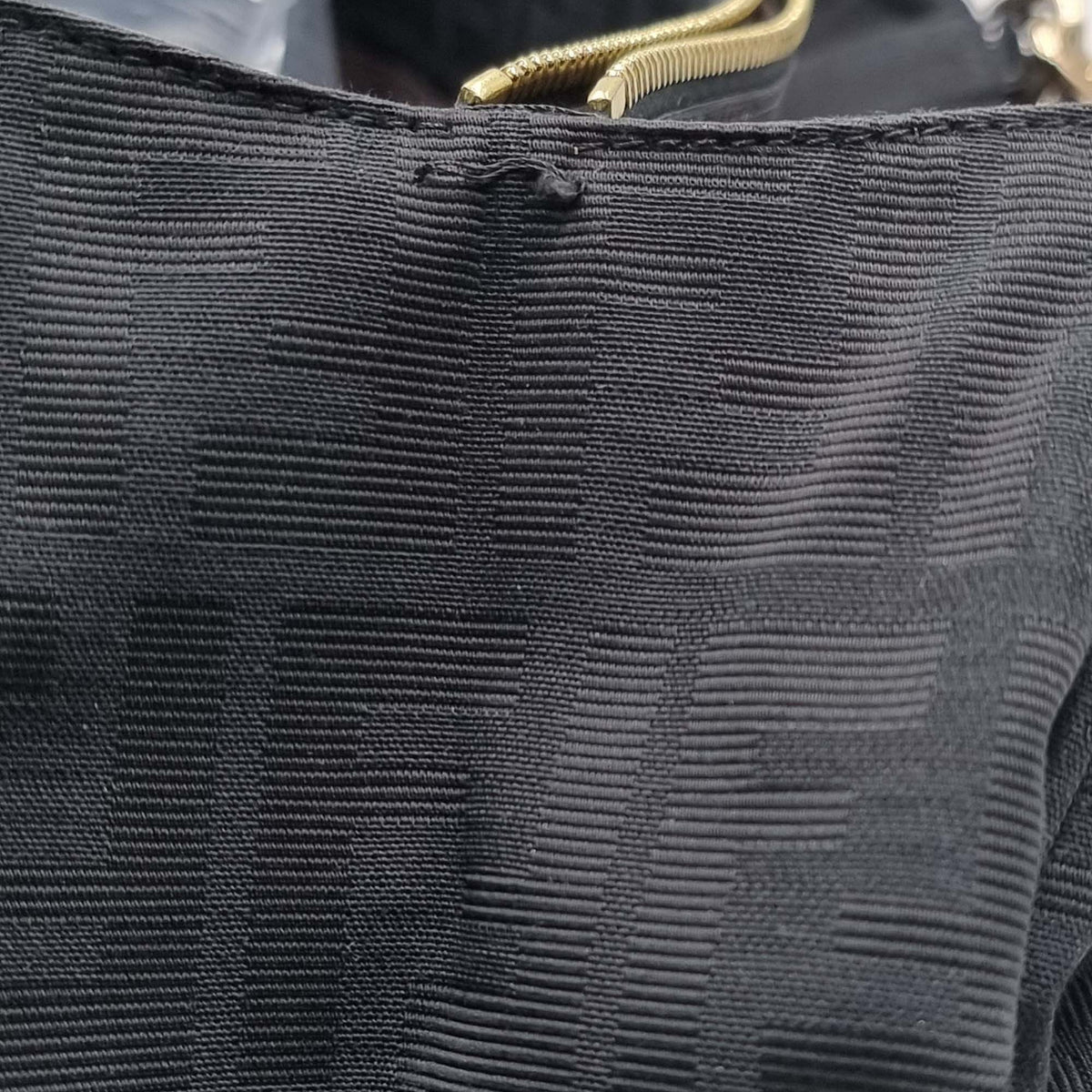 Close-up of Large bags hardware and fine stitching