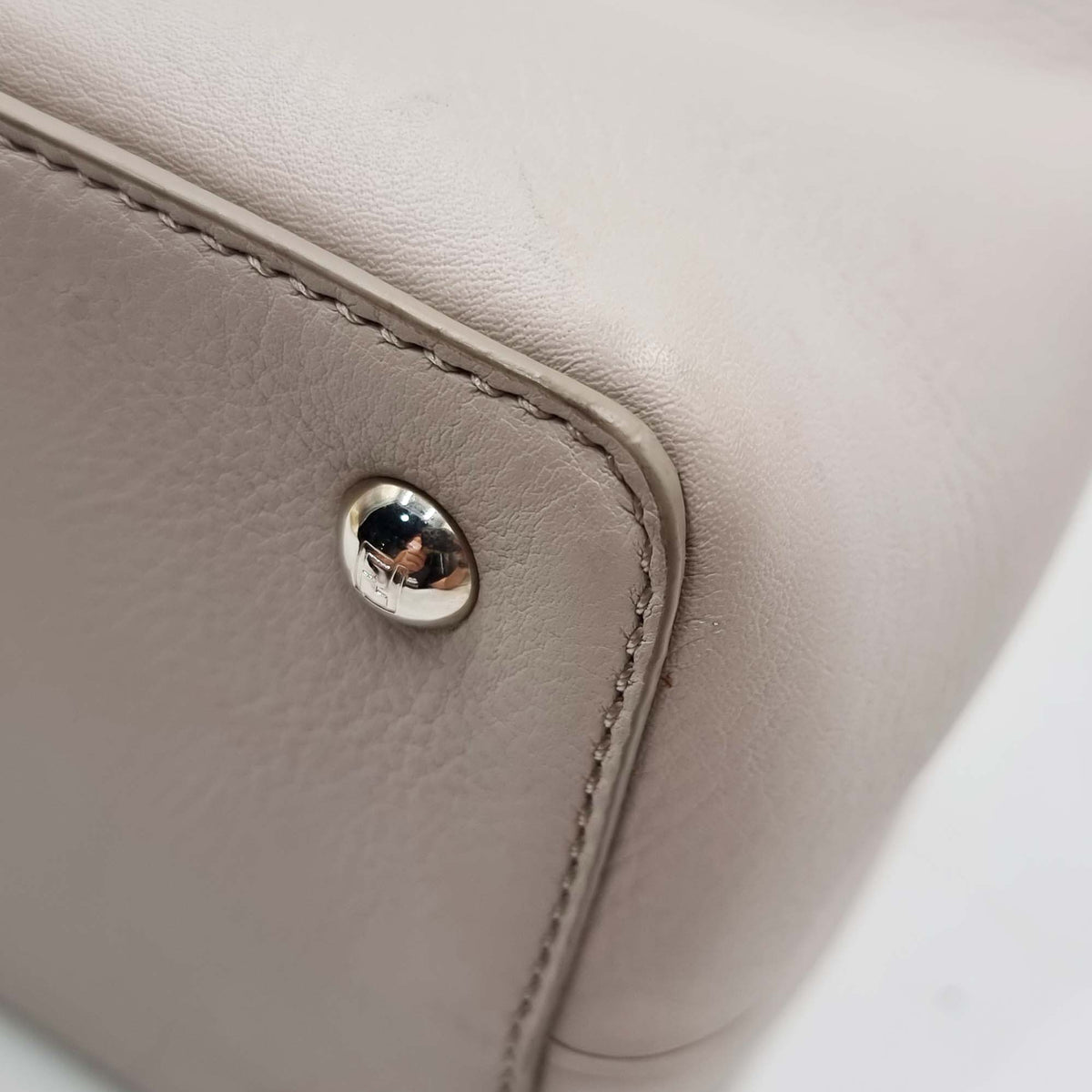 Close-up of Petite bags hardware and fine stitching