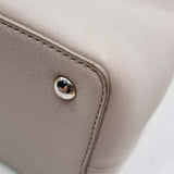 Close-up of Petite bags hardware and fine stitching