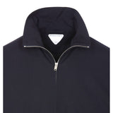 Close-up of Bottega Veneta jackets hardware and fine stitching