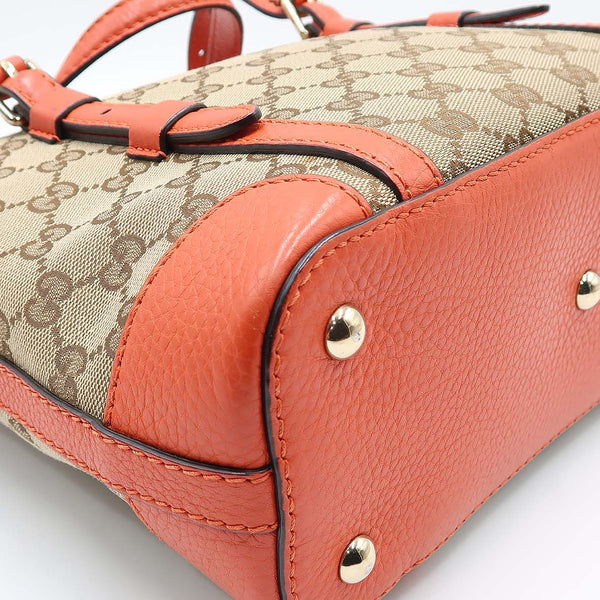Close-up of Belted bags hardware and fine stitching
