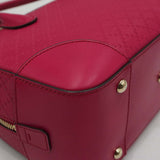 Close-up of Bright bags hardware and fine stitching