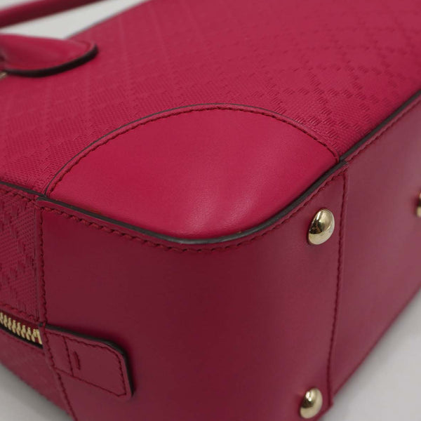 Close-up of Bright bags hardware and fine stitching
