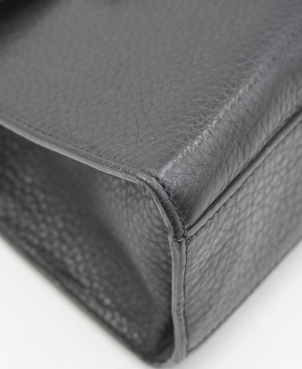 Close-up of Gucci bags hardware and fine stitching
